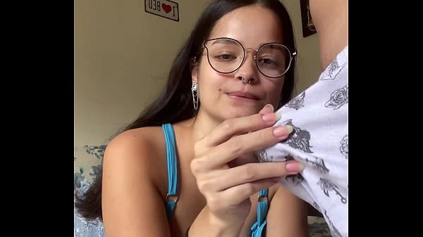Busty brunette nerd giving a deep blowjob to Wellington Prado’s big dick with her back to the mirror in denim shorts